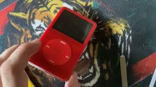 12 My red devil iPod opened up - I explain the issues with its clickwheel and say MB instead of GB